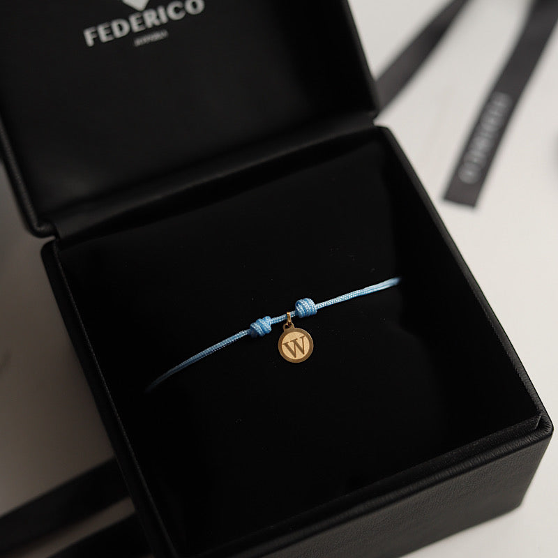 Inicial redonda bracalet oro 18kt