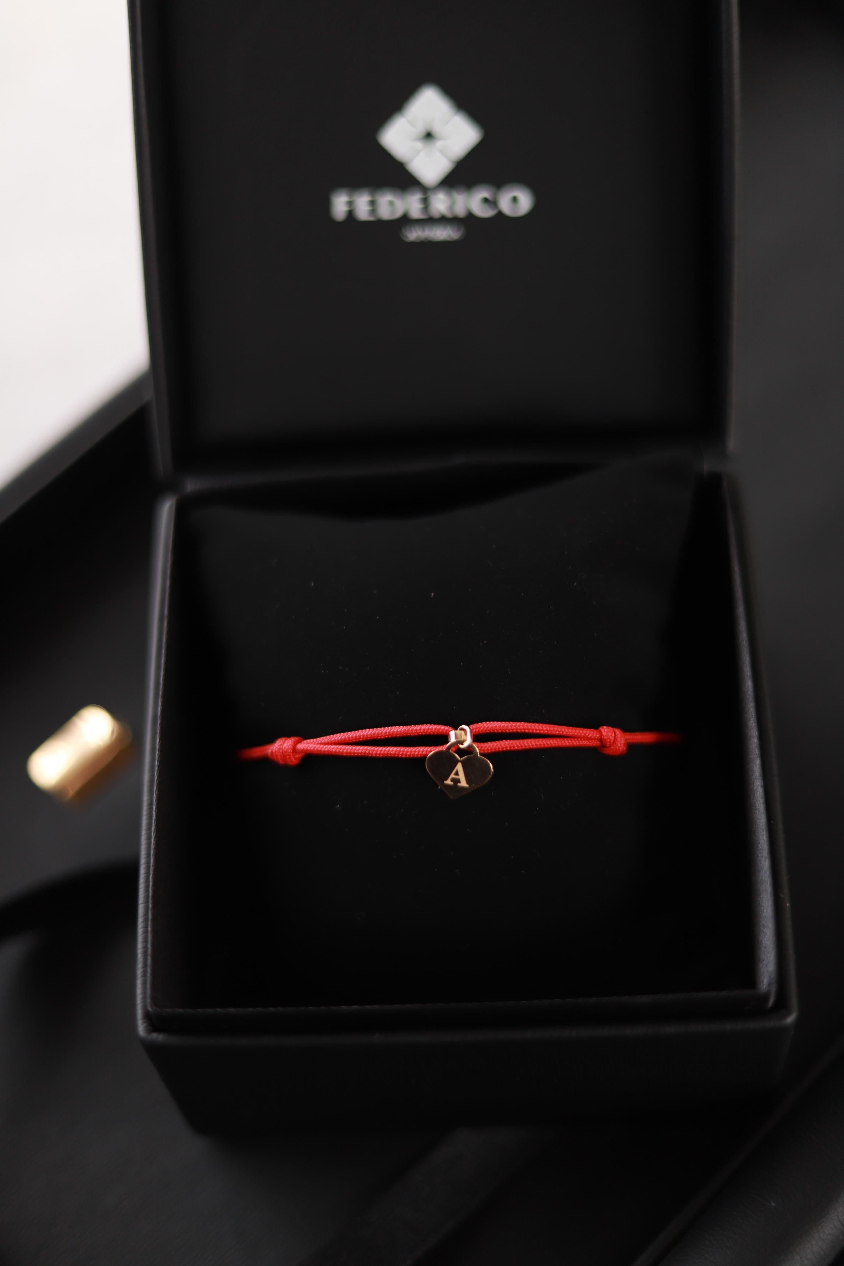 Corazón inicial 18 Kt